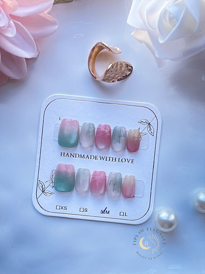 Petite pink gradient press-on nails with soft rose ombré on a display card