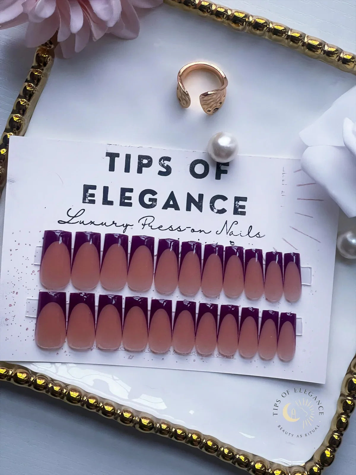 Nail art tips packaging with a ring and pearl on a decorative tray