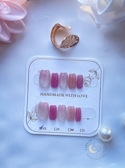 Petite pink gradient press-on nails with soft rose ombré on a display card